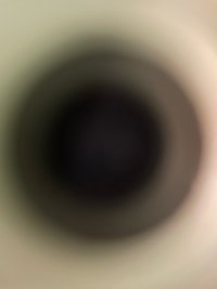 a blurry image of a black donut